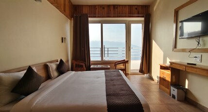 Samrat Inn Room Type - Deluxe Room with Balcony