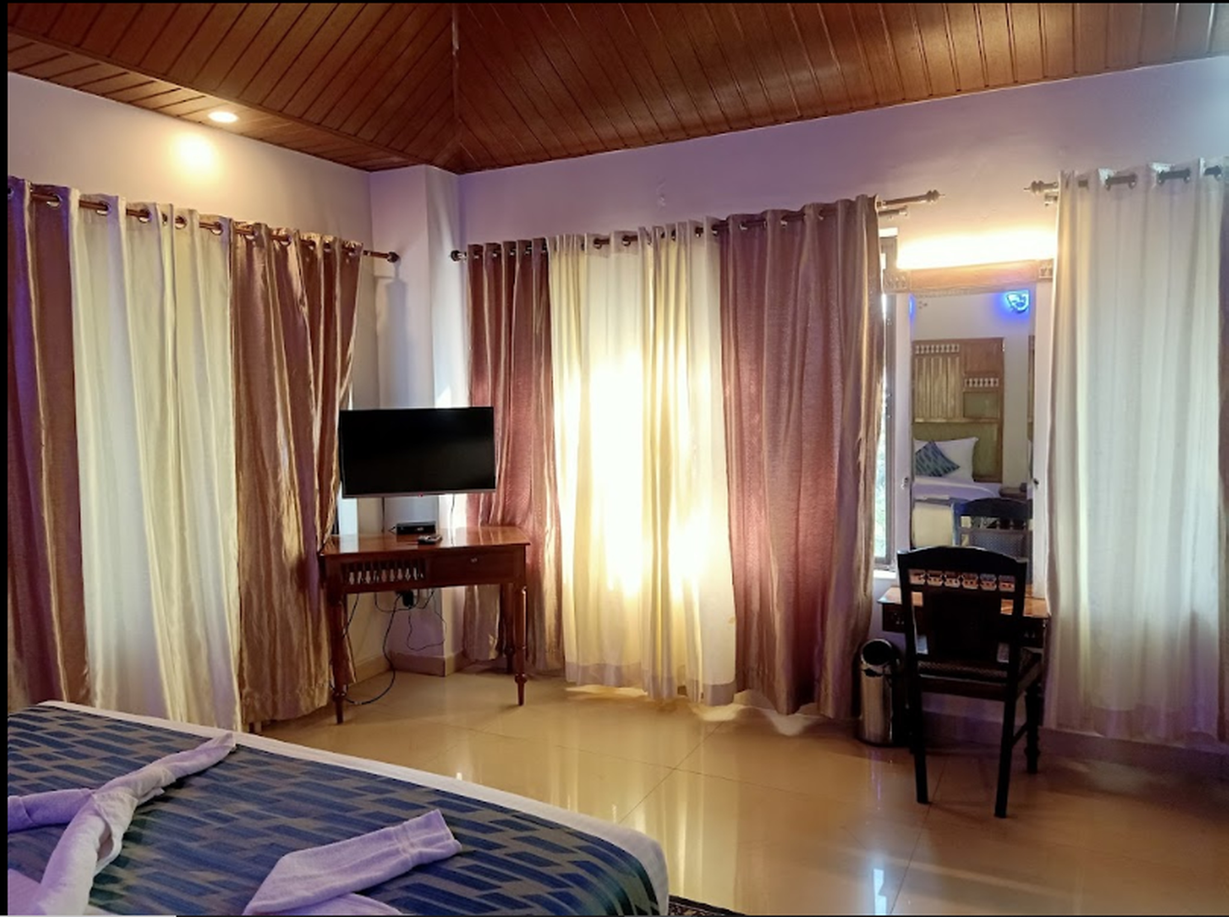 Violet Woods - Tap to explore photos