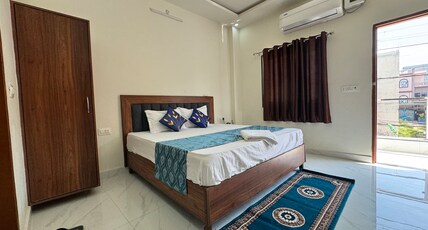 Shree Hanumat Kripa Dham Room Type - Deluxe Room with Balcony King Bed
