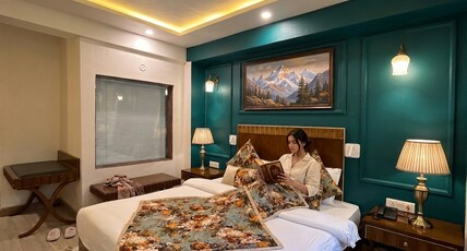 Swiss cottage(In house parking) Room Type - Deluxe Room