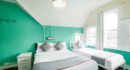 OYO Devine Beach Hotel Room Type - Deluxe Triple Room