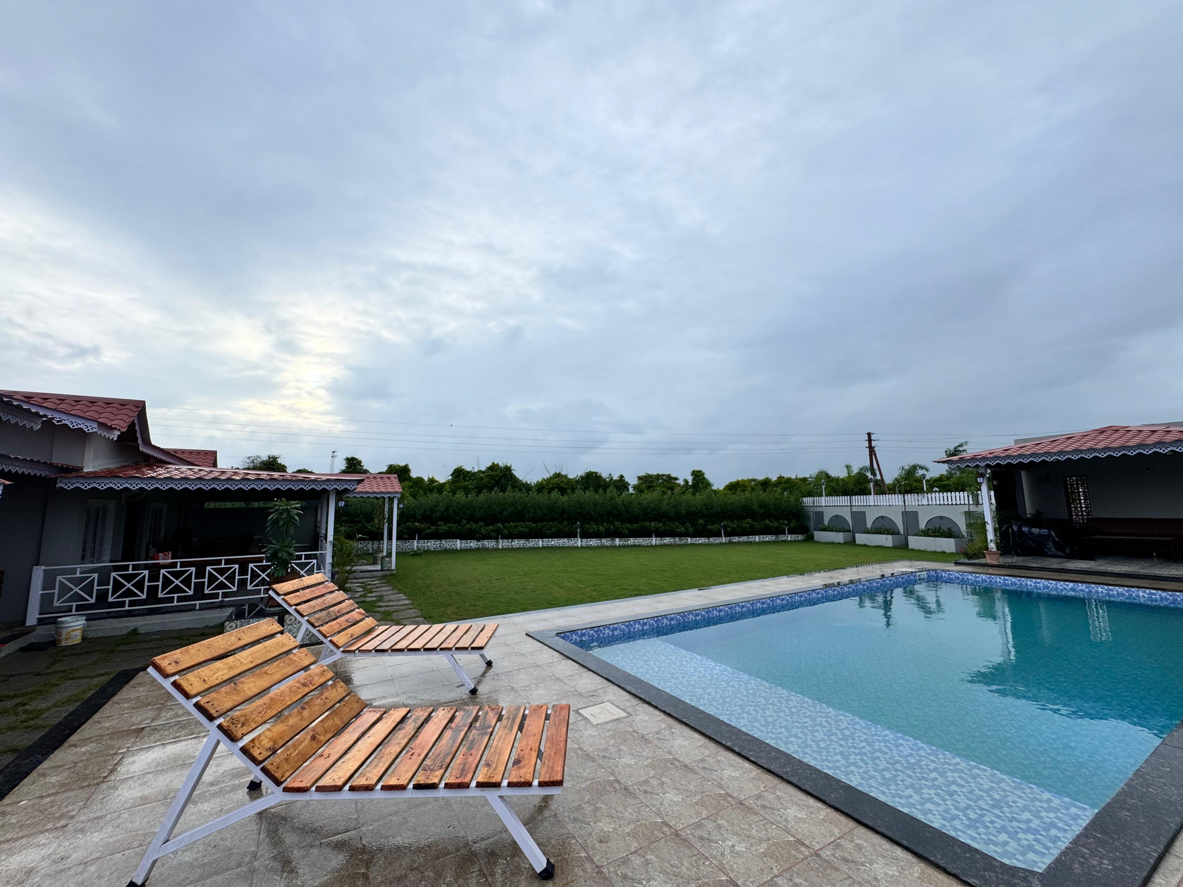 Green Bliss 3BHK with Pvt Pool by Stayvilla - Tap to explore photos