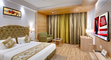 The Orchard Greens Resort (A centrally heated property) Room Type - Deluxe Room without balcony (Partial View) The Orchard Greens Resort (A centrally heated property) Room Type - Deluxe Room without balcony (Partial View)