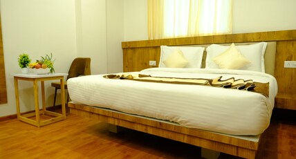 Girija Sunrise (300 Meter from Baba Dham Temple) Room Type - Suite with Balcony & Living Area