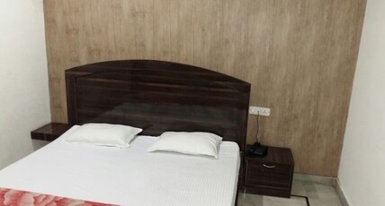 MD Deluxe Hotel  Room Type - Deluxe Room (AC)