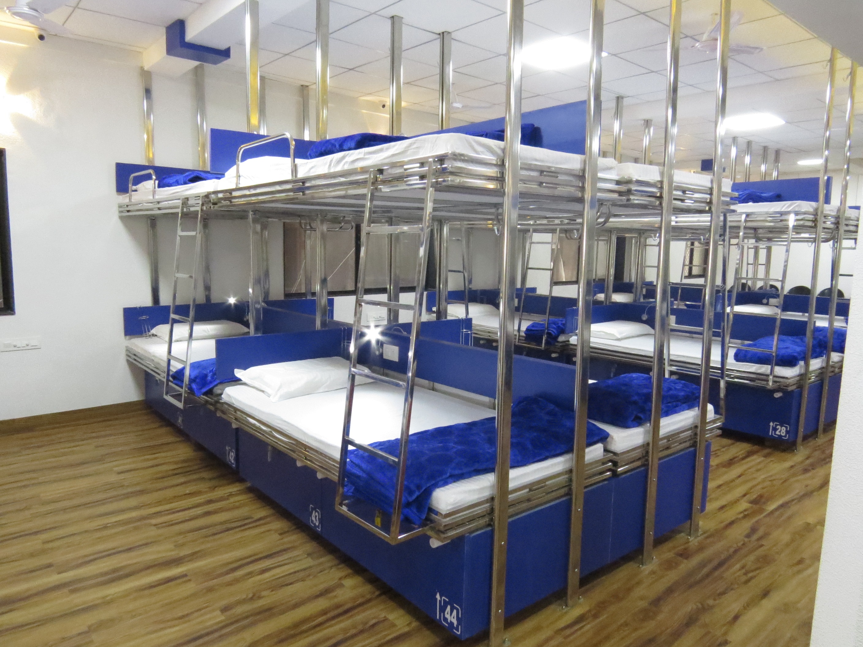 Jainam Dormitory | Bunks in an AC Dorm - Tap to explore photos