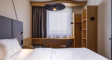 Hotel ibis Friedrichshafen Airport Messe Room Type - Room with double bed and sofa