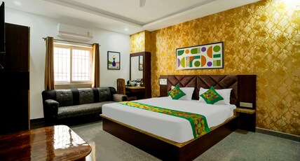 Treebo NPS Grand Room Type - Spacious Deluxe Room With Seating Area