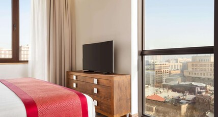 Ramada Hotel & Suites by Wyndham Yerevan Room Type - Superior Family Suite (2 bedrooms), 1 King bed and 2 Twin beds Ramada Hotel & Suites by Wyndham Yerevan Room Type - Superior Family Suite (2 bedrooms), 1 King bed and 2 Twin beds