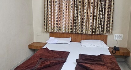 Hotel SaiKiran Surat Room Type - AC Deluxe Room