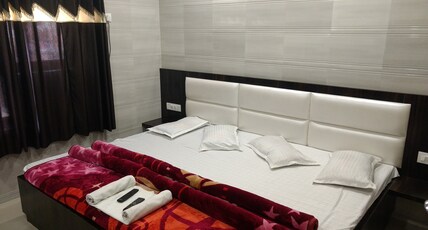 Aashiyana Inn Hotel Room Type - FOUR BED NON AC Deluxe Room