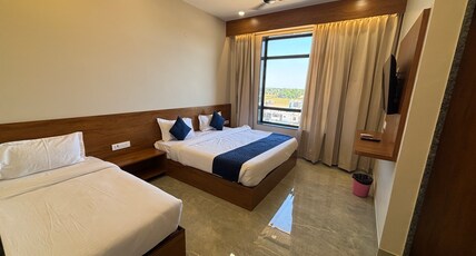Hotel Sisodiya Palace (Free Gated Parking & 10 Minutes walk from Temple) Room Type - Deluxe Triple Room ( 1 Double Bed + 1 Single Bed )