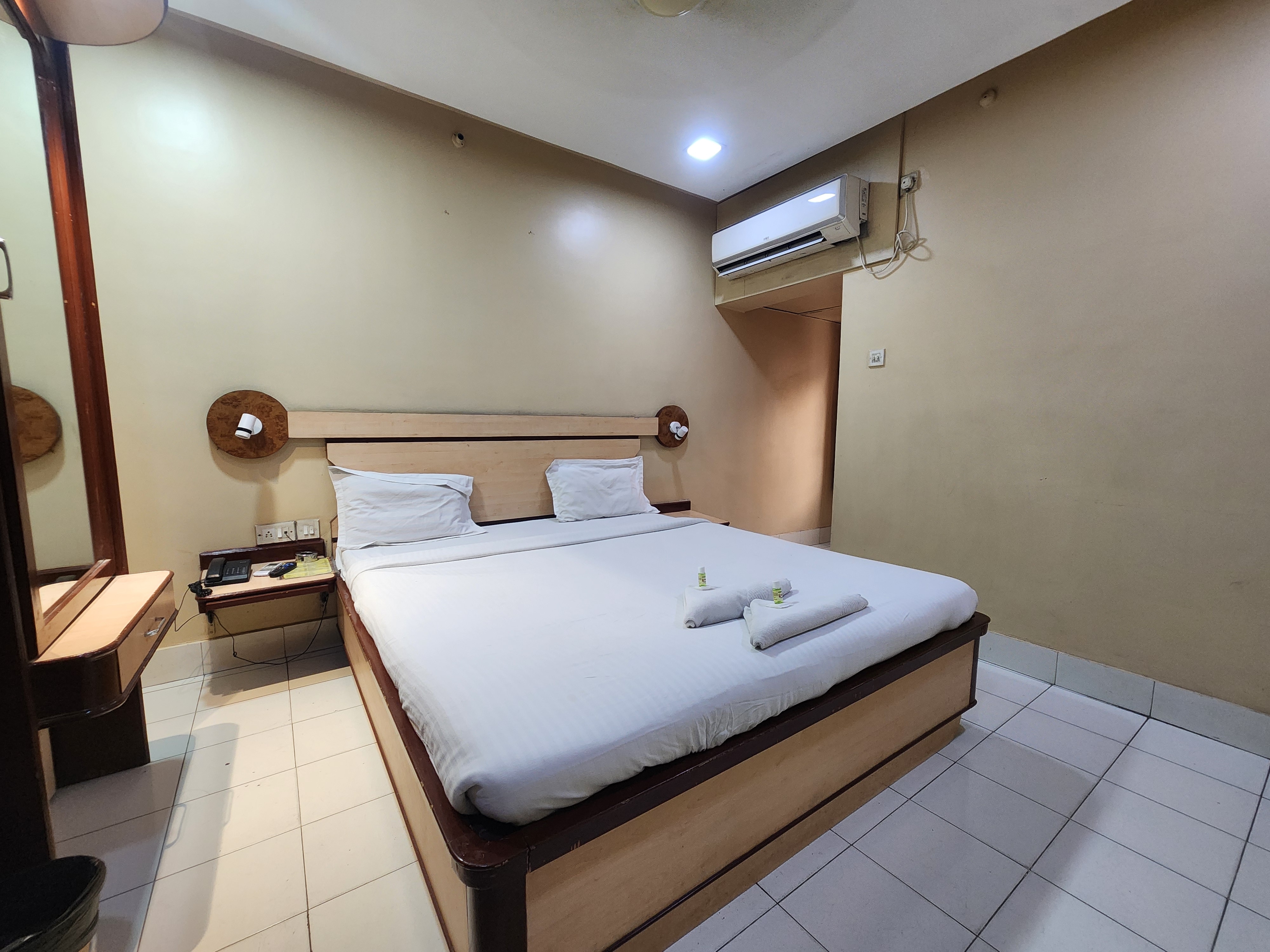 Hotel Pushpak International - Tap to explore photos