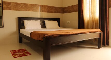 Kutralam Ezhilagam Hotel Room Type - Premium Family suite With Kitchen Non AC- Shenbagam (3 Bedrooms with 3 Bathrooms and 1 balcony)