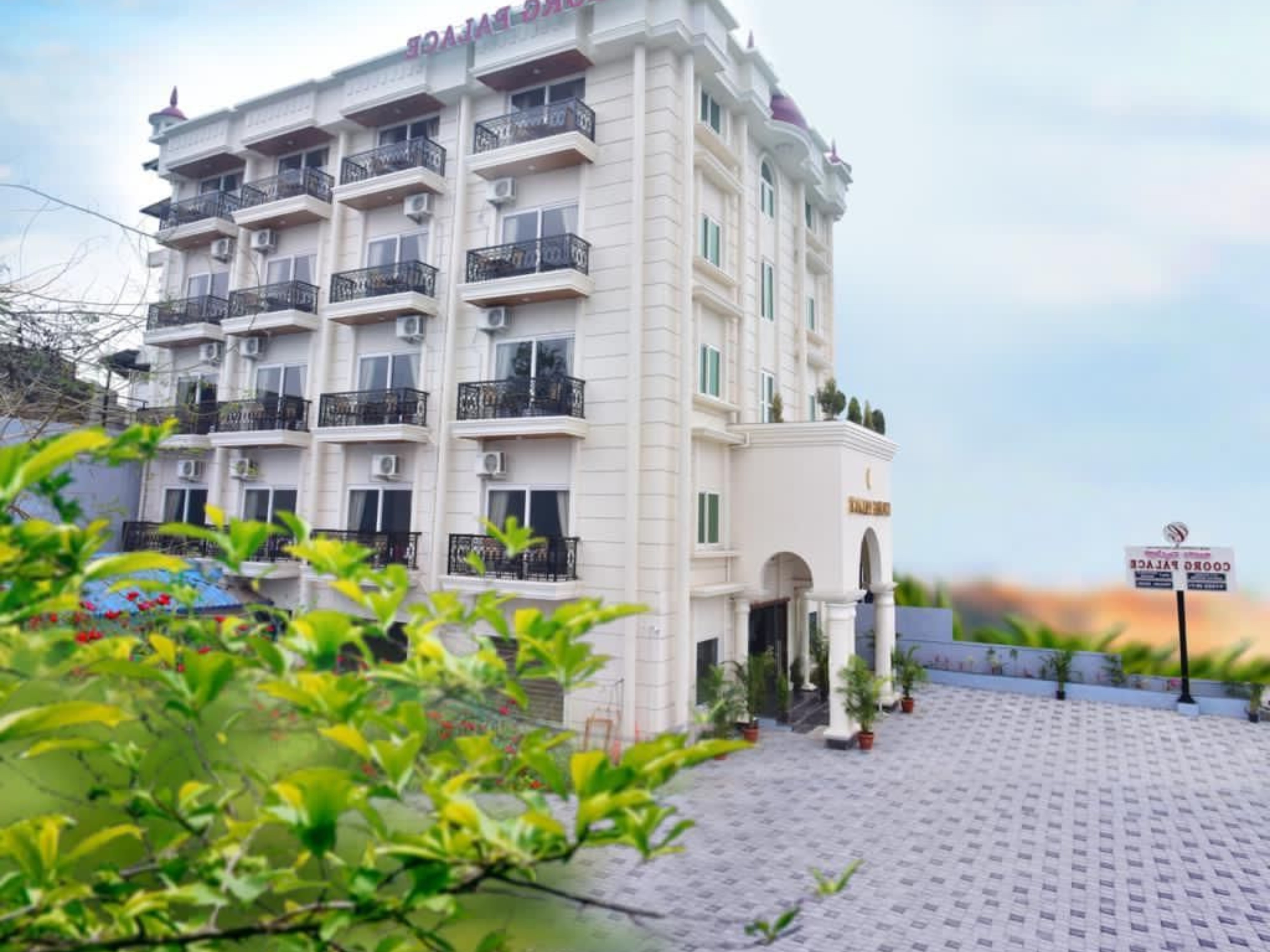 HOTEL COORG PALACE INN - Tap to explore photos