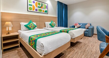 Treebo Paras International Room Type - Spacious Premium Room
