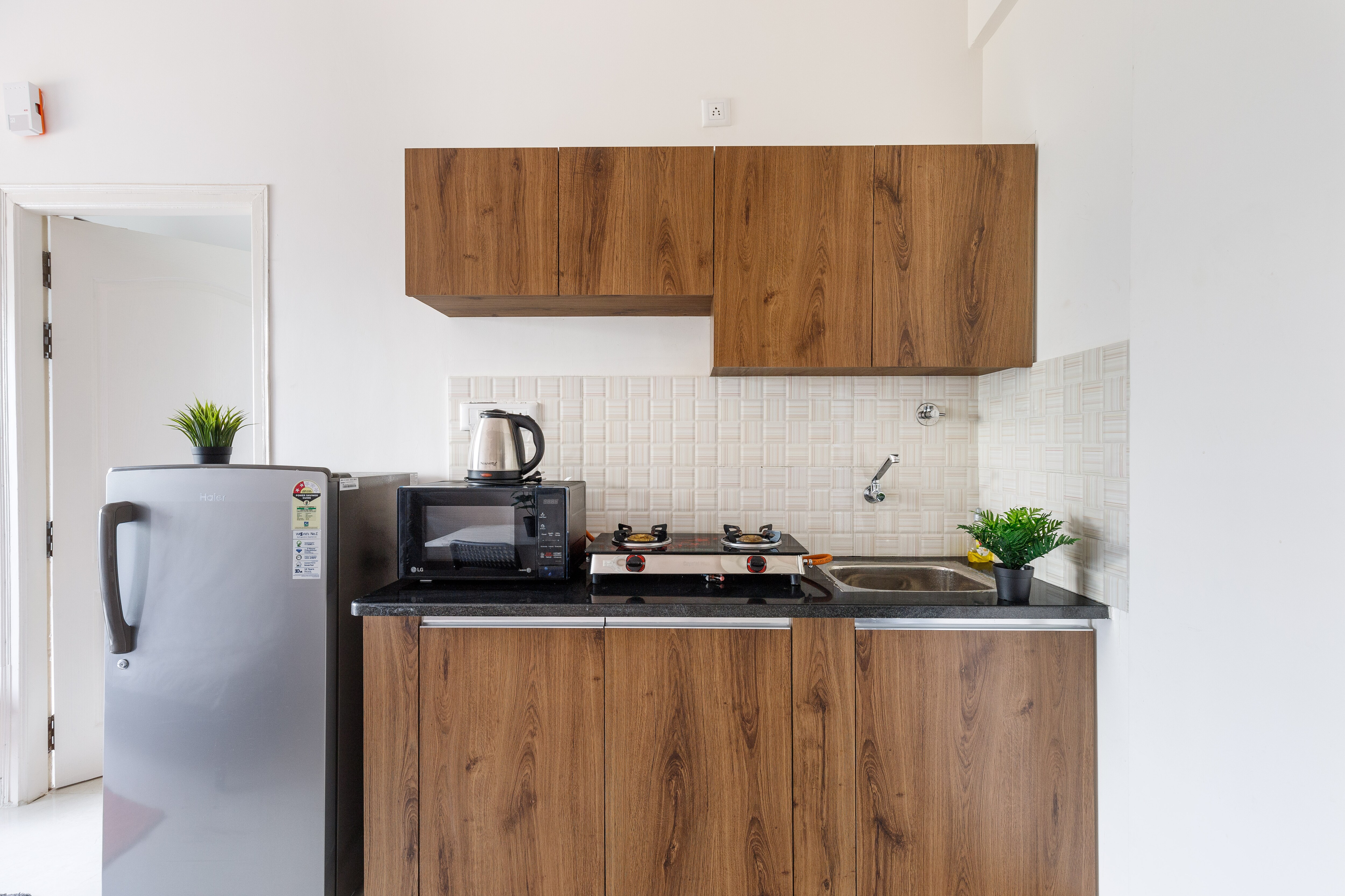 The Sunrise Studio Service Apartment - Tap to explore photos