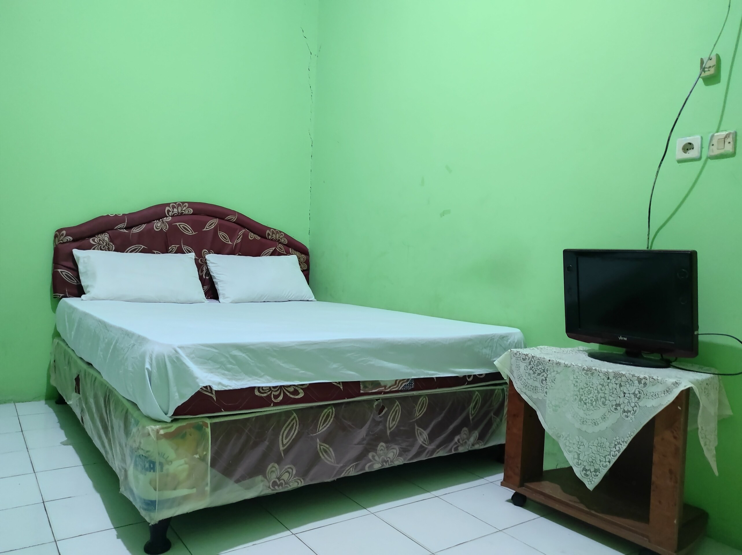 Hotel O Penginapan Syariah Al Syifa - Tap to explore photos