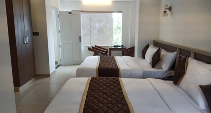Paul Residency Nedumbassery Room Type - Deluxe Room AC