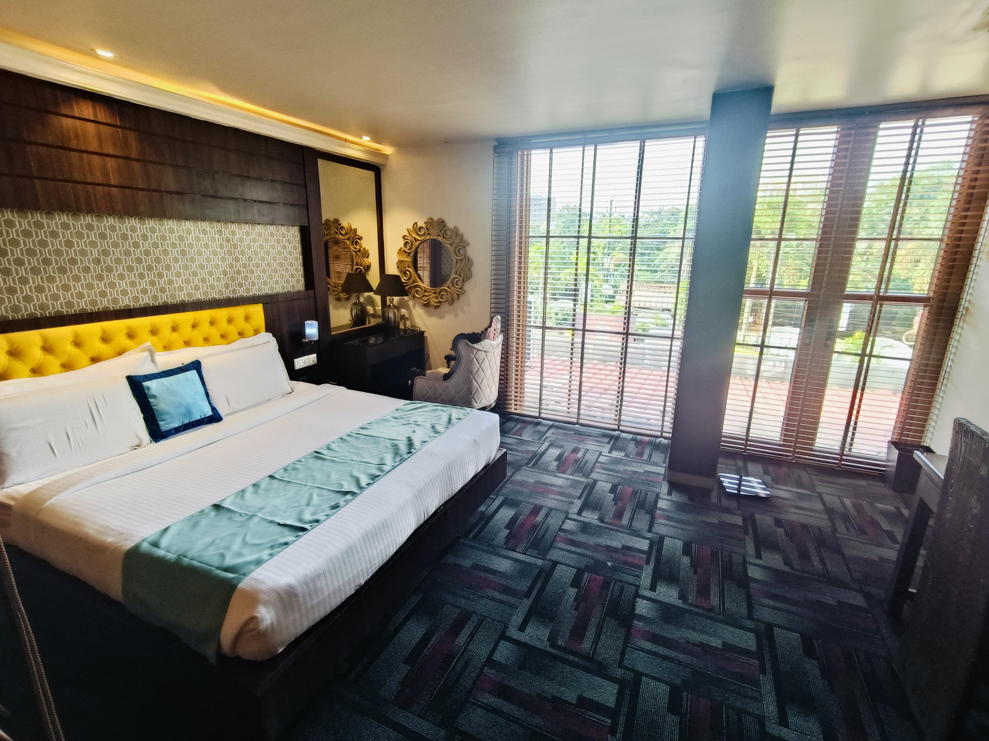 Vatika Premier Hotel - Tap to explore photos