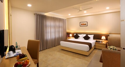 Flora Charishma Residency Aluva Room Type - Deluxe Delight