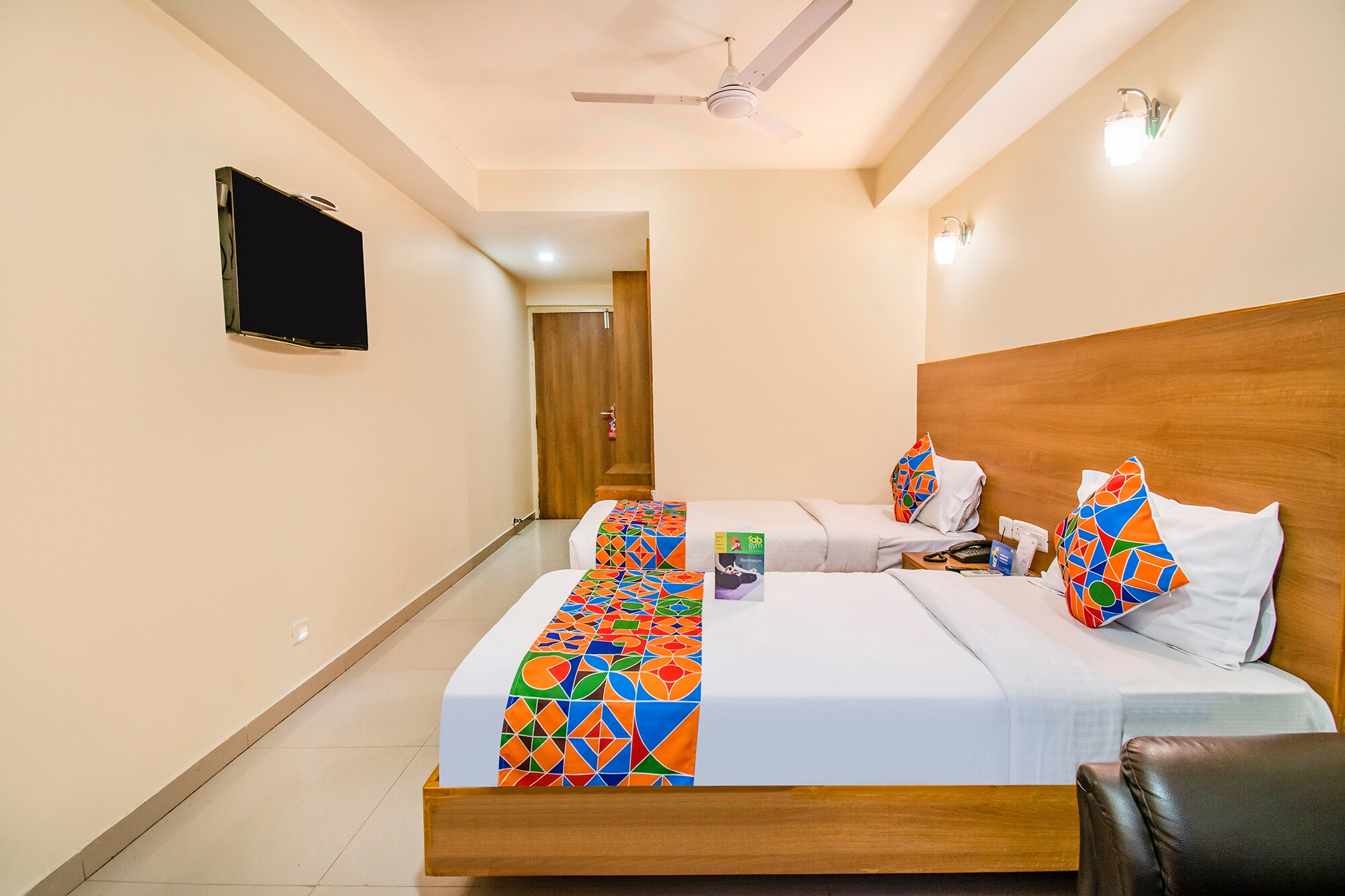 FabHotel Jansi Deluxe - Nr. Gandhipuram Bus Stand - Tap to explore photos