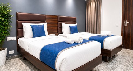 Axon Corporate Stays Sector 52 Gurgaon Room Type - Deluxe Twin Rooms with City View