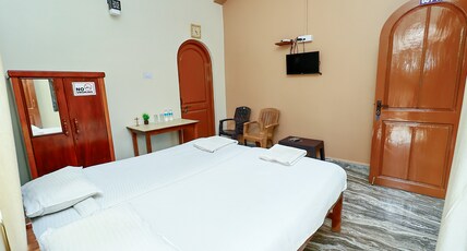 Caphina Coastal Comforts Room Type - Deluxe AC Studio Apartment with Private Balcony
