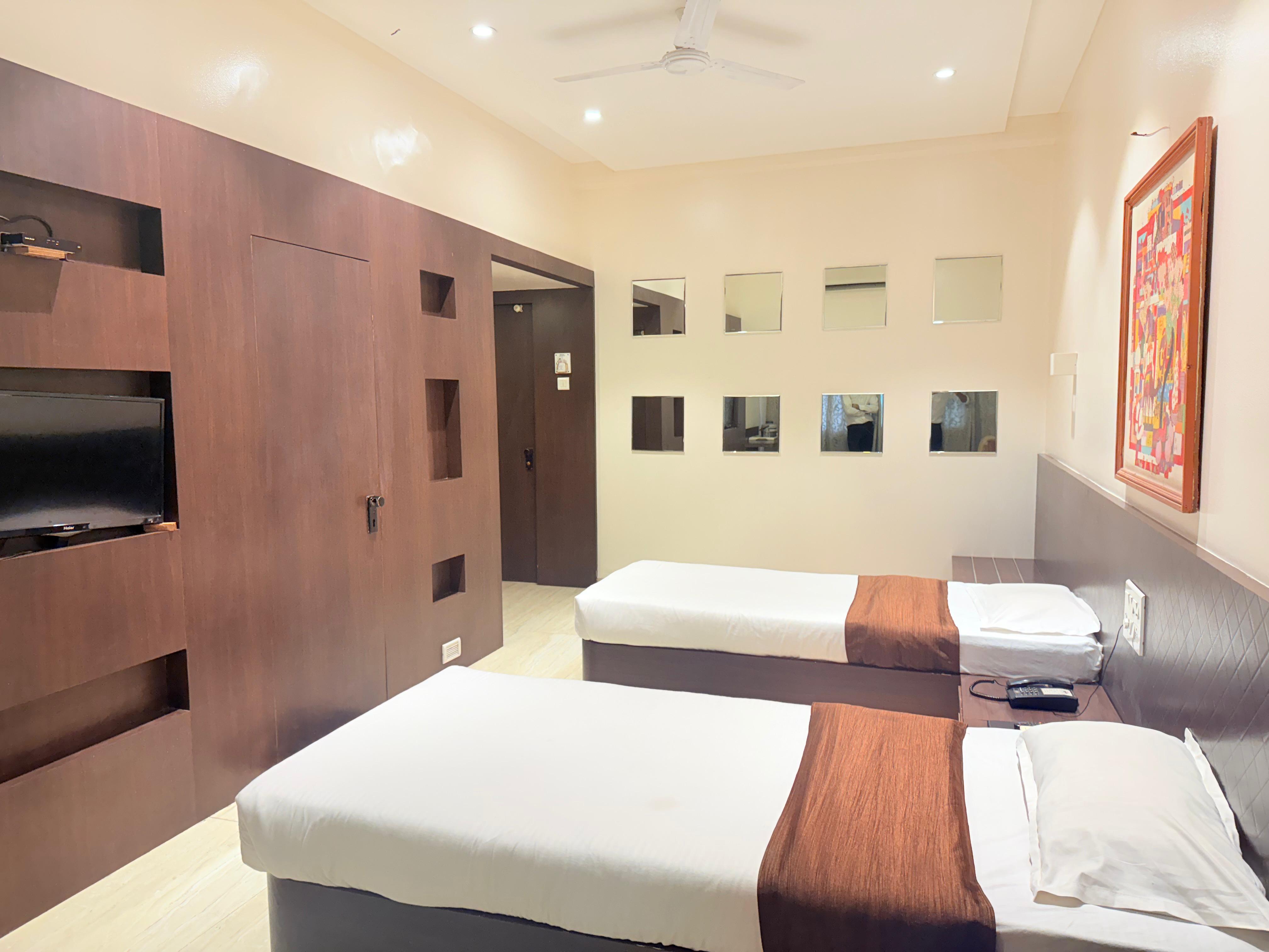 Hotel Sanket - Tap to explore photos