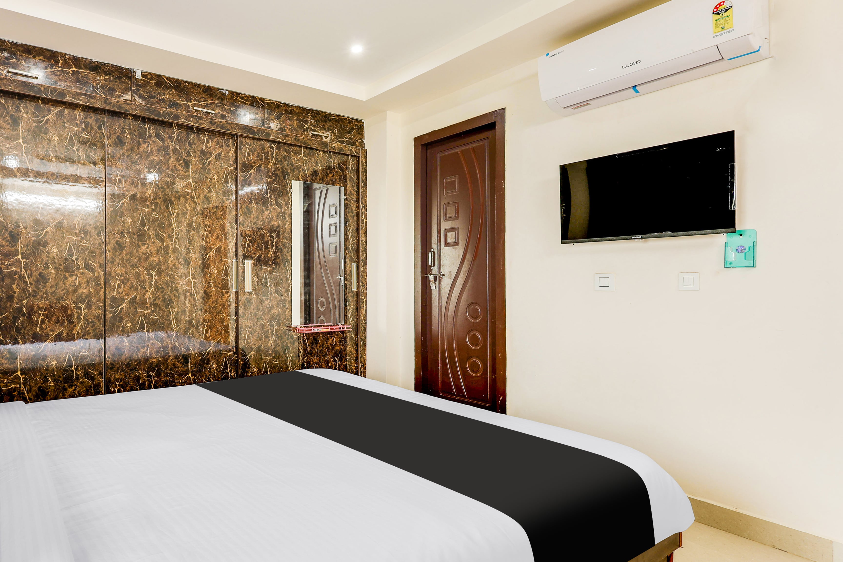 Hotel O Relax Guest Rooms - Tap to explore photos
