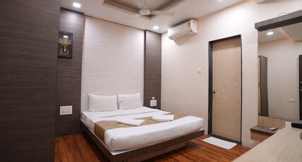 Hotel Madhuri Executive( 3 Minutes Walk to Mahalaxmi Temple ) Room Type - Standard AC Double Bed Room