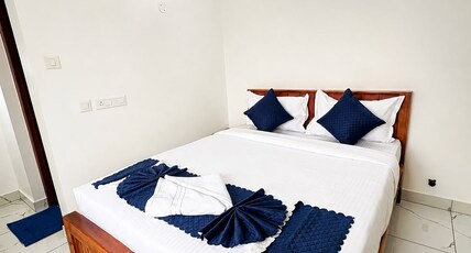 Aura Suites(Near Amrita Hospital) Room Type - Deluxe AC Room