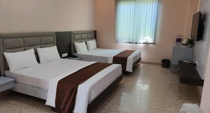 JAANKI FARMS & RESORTS Room Type - Premium King Twin Bed Room