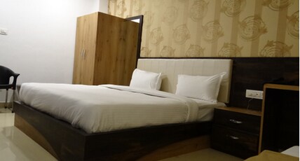 Shree Kailash Hotel & Restaurant Room Type - FOUR BED DELUXE ROOM