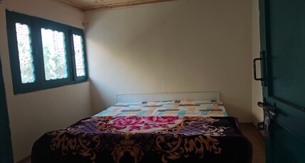The Eleventh Homestays Room Type - Standard Room with common washroom