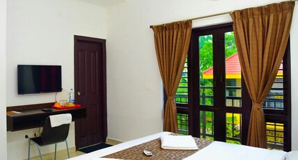 Varsha Enclave- Trinity house Room Type - Deluxe Room AC