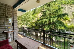 Tirthan river front farm stay.