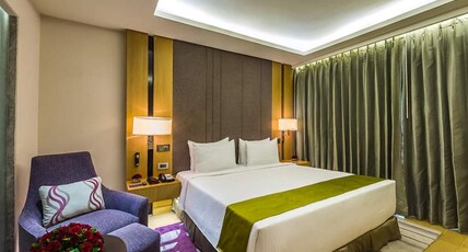 Radisson Blu Hotel Guwahati Room Type - Suite 1 Bedroom with separate living room, Bath tub, bottle of House wine & 2 way airport transfer 