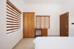 Bastiat Stays Modern 1BHK Near Kaloor Stadium