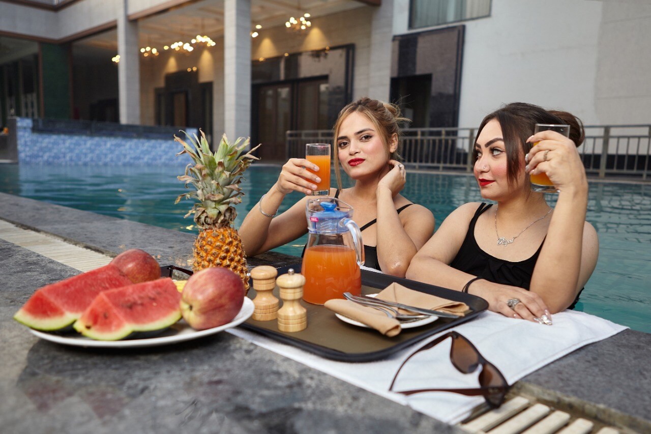 Palm Green Hotel & Resorts with Pool & Lawn - Tap to explore photos