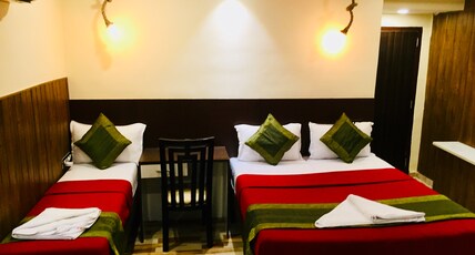 QubeStay TownHostel Room Type - AC Deluxe  Room with Attached Bathroom.