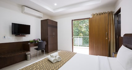 Sanctum Suites BEL Road Bangalore Room Type - Standard King Room with Balcony Sanctum Suites BEL Road Bangalore Room Type - Standard King Room with Balcony