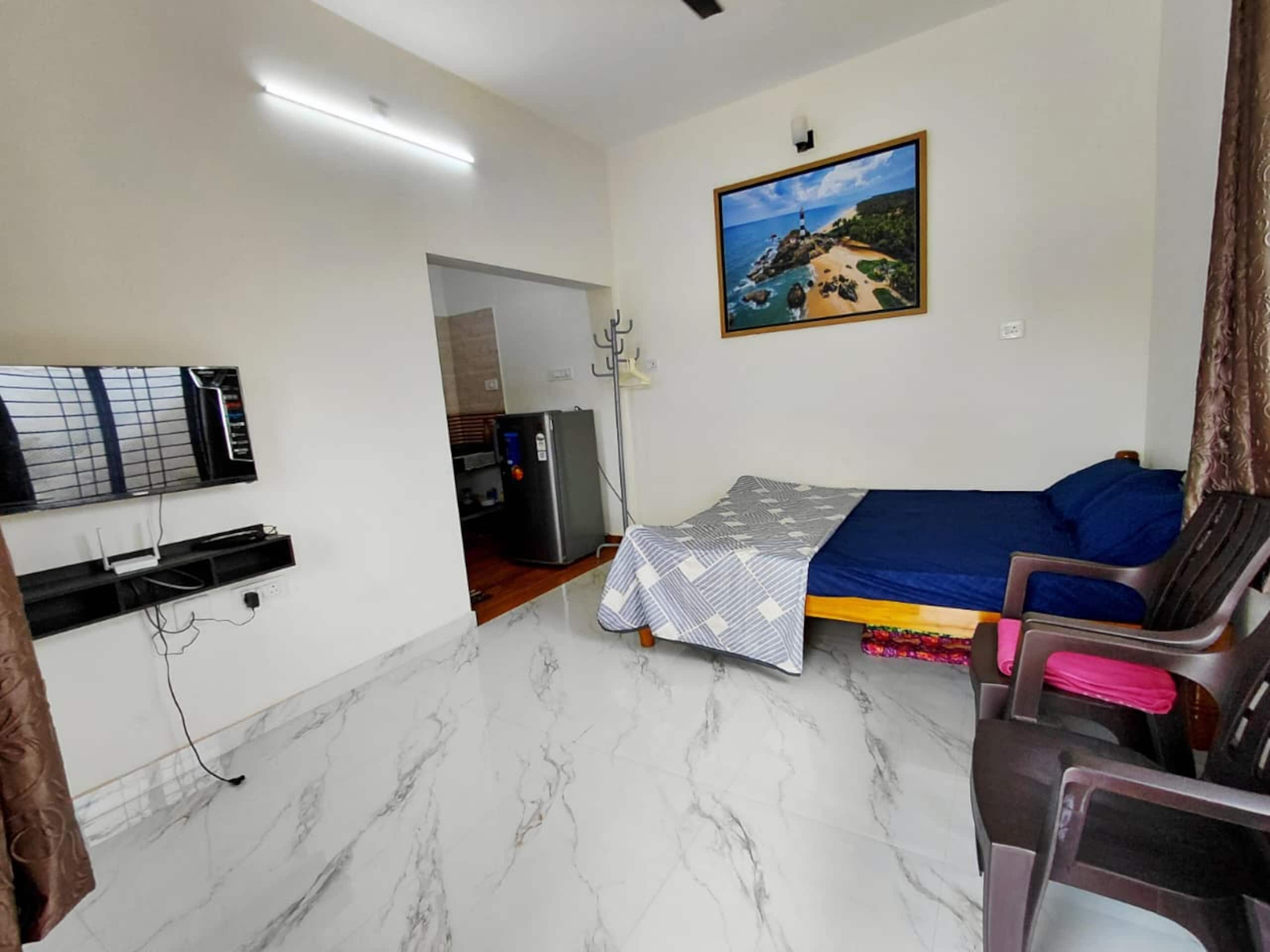 AGM Budget Non-AC Studio suite with Kitchen and Bath - Tap to explore photos