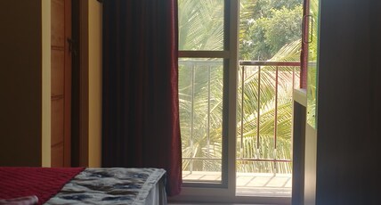URBAN STAY Room Type - AC Deluxe Room with Balcony