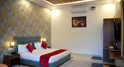 The Veda Greens Resort Room Type - Deluxe Room garden facing and sit out area