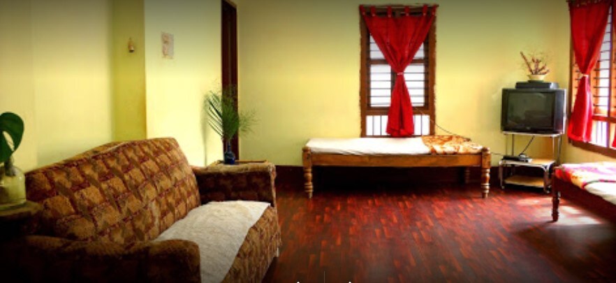 Sakthi Homestay | Rooms & Caretaker - Tap to explore photos
