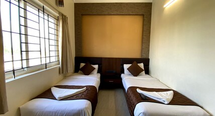 NITHYAA GRAND Room Type - Twin Bedded Room