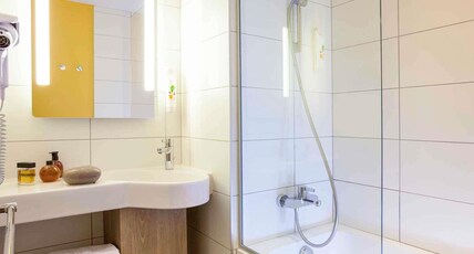 ibis Styles Chaumont Centre Gare Room Type - Standard Family Room with a double bed and a sofa bed