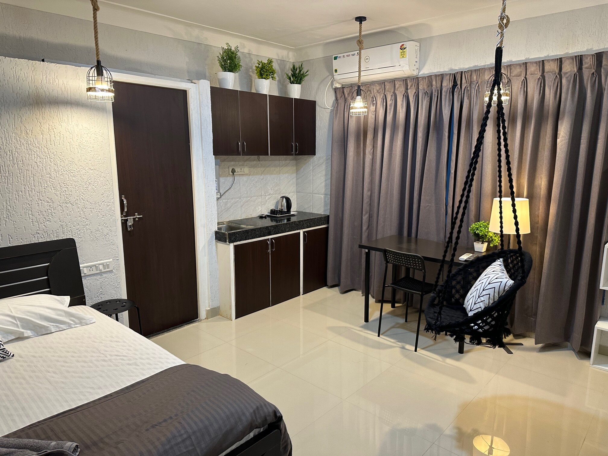 The Swing Private Studio Room in Koregaon Park Ac WiFi Smart Tv Kitchenette - Tap to explore photos