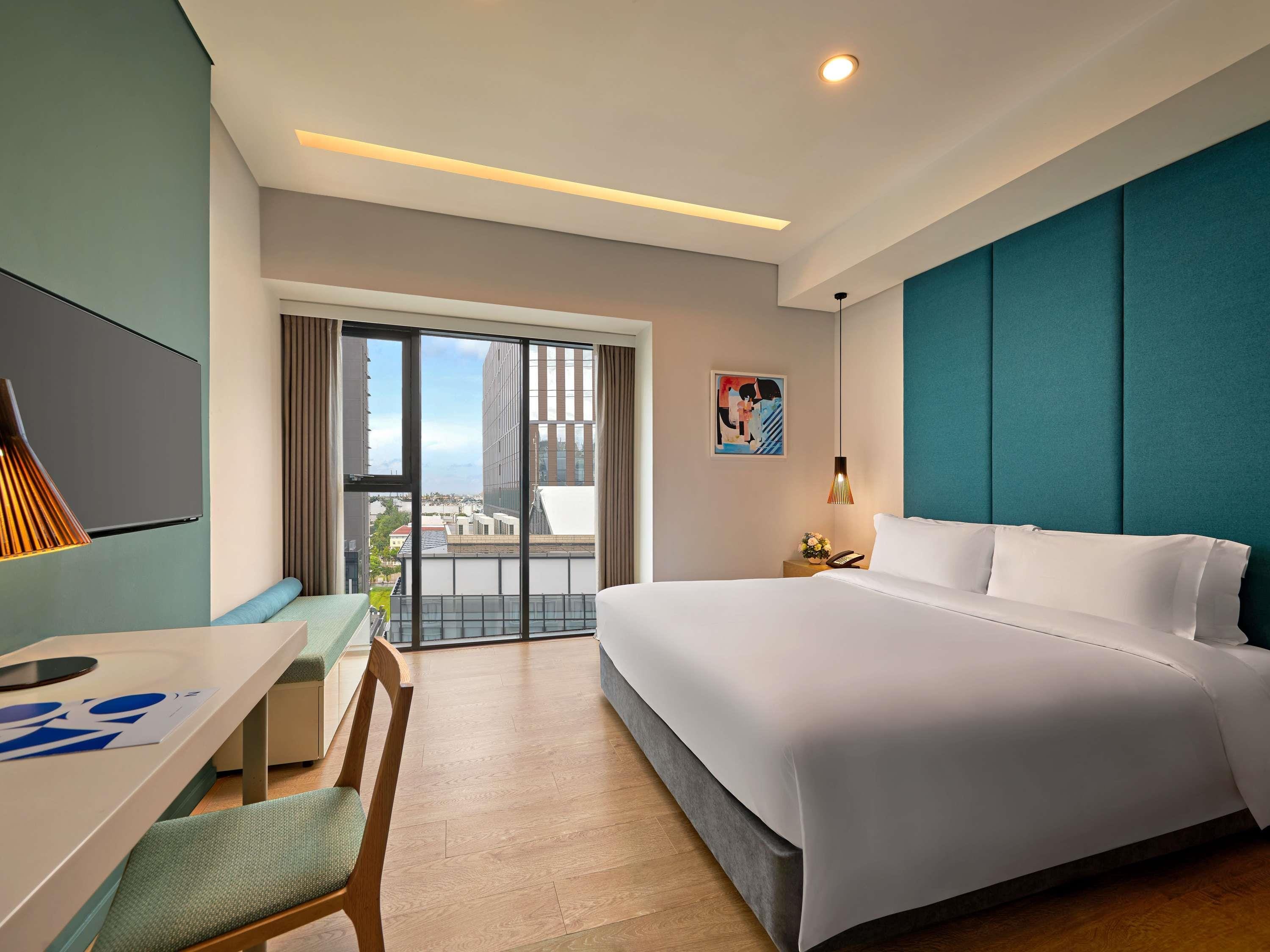 Novotel Living Saigon South - Tap to explore photos